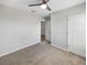 Neutral bedroom featuring plush carpet and ceiling fan, offering a serene retreat at 1925 Arbor Mill Ln, Kissimmee, FL 34744