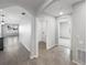 Open hallway featuring tile flooring, leading to various rooms and spaces at 1925 Arbor Mill Ln, Kissimmee, FL 34744