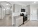 Well-equipped kitchen features granite countertops, stainless steel appliances, and grey cabinetry at 1925 Arbor Mill Ln, Kissimmee, FL 34744