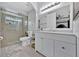 Bathroom featuring modern vanity with new fixtures, and glass enclosed shower at 211 Dalton Dr, Kissimmee, FL 34758