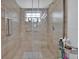 Walk in shower featuring tile surround and a glass door at 211 Dalton Dr, Kissimmee, FL 34758