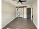 Spacious main bedroom with dark wood floors, gray walls, and modern black hardware at 214 Cherrywood Dr, Maitland, FL 32751