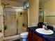 Bathroom with large shower stall, blue countertop and ceramic vessel sink at 229 Silverton Rd, Davenport, FL 33897