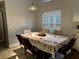 Bright dining room with a large table perfect for Gathering gatherings at 229 Silverton Rd, Davenport, FL 33897