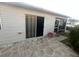 Backyard view with a sliding glass door and access to the screened-in lanai at 2450 Southern Oak St, The Villages, FL 32162