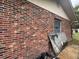 Image displays the brick wall on the side of the house, highlighting durable construction and curb appeal at 2626 Balkan St, Apopka, FL 32703