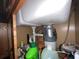 A view under the kitchen sink highlighting the garbage disposal unit and plumbing, ensuring efficient waste management at 2626 Balkan St, Apopka, FL 32703