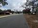 Neighborhood street view with houses and trees, showcasing a peaceful residential area at 2626 Balkan St, Apopka, FL 32703