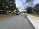 Scenic street view showcasing the well-maintained homes and lush greenery of the neighborhood at 2626 Balkan St, Apopka, FL 32703