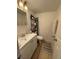 Bathroom featuring a white vanity, toilet, and mirror at 2761 L B Mcleod Rd # A, Orlando, FL 32805