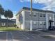 Exterior view of apartment building and parking area with palm trees at 2761 L B Mcleod Rd # A, Orlando, FL 32805