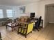 Cozy living room with tile floors, a comfortable couch and a work space at 2761 L B Mcleod Rd # A, Orlando, FL 32805