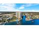 Beautiful aerial view of a waterfront condo building on a canal leading to the open bay at 2801 S Ridgewood Ave # 1412, South Daytona, FL 32119