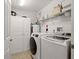 Clean laundry room featuring front loading washer and dryer at 2801 S Ridgewood Ave # 1412, South Daytona, FL 32119