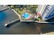 A unique clover-shaped pool with lounge chairs overlooks the peaceful bay on condo property at 2801 S Ridgewood Ave # 1412, South Daytona, FL 32119