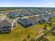 Expansive aerial view of a residential neighborhood showcasing well-maintained homes and green spaces at 2993 Irish Peach Dr, Winter Garden, FL 34787