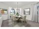 Elegant dining room features a modern table, chairs, and bright natural light at 2993 Irish Peach Dr, Winter Garden, FL 34787