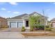 Inviting single-story home with brick driveway, two-car garage, and tidy landscaping at 2993 Irish Peach Dr, Winter Garden, FL 34787