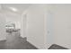 Bright hallway leading into an open-concept living room, showcasing the home's layout at 2993 Irish Peach Dr, Winter Garden, FL 34787