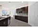 This kitchen features stainless steel appliances, dark wood cabinets, granite countertops, and an eat-in nook at 2993 Irish Peach Dr, Winter Garden, FL 34787