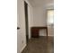 Bedroom featuring natural light from a window, a desk, and speckled floors at 3112 Eleuthera Ln, Orlando, FL 32827