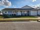 Charming single-story home with manicured lawn, attached garage, and covered entryway at 3112 Eleuthera Ln, Orlando, FL 32827