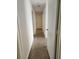 Neutral hallway leading to rooms at 3112 Eleuthera Ln, Orlando, FL 32827