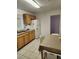 Functional kitchen with ample cabinet space, white appliances, and eat-in dining area at 3112 Eleuthera Ln, Orlando, FL 32827