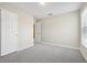 Bedroom with closet and window letting in natural light and neutral walls and carpet at 3350 Pegaso Ave, New Smyrna Beach, FL 32168