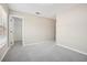 Bedroom with neutral walls and carpet leading to closet with wire shelving at 3350 Pegaso Ave, New Smyrna Beach, FL 32168