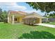 Two-story home featuring a well-manicured lawn, driveway, and a two-car garage at 3350 Pegaso Ave, New Smyrna Beach, FL 32168