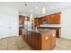 Kitchen featuring wood cabinets, stainless steel appliances, and a large center island at 3350 Pegaso Ave, New Smyrna Beach, FL 32168