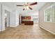 Spacious open area with tile flooring, ceiling fan, and a view into the kitchen at 3350 Pegaso Ave, New Smyrna Beach, FL 32168