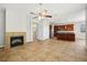 Open living space with tile flooring, a fireplace, and a view of the kitchen at 3350 Pegaso Ave, New Smyrna Beach, FL 32168