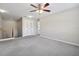 Open loft space with neutral carpeting and natural light at 3350 Pegaso Ave, New Smyrna Beach, FL 32168