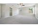 Spacious main bedroom with closet and windows letting in natural light and ceiling fan at 3350 Pegaso Ave, New Smyrna Beach, FL 32168