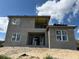 Back exterior of a two-story home under construction, with a focus on window placement at 336 Caladium Ave, Lake Alfred, FL 33850