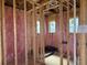 Bathroom featuring the initial stages of construction and pink insulation at 336 Caladium Ave, Lake Alfred, FL 33850