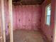 Bedroom with the initial stages of construction including insulation and newly installed windows at 336 Caladium Ave, Lake Alfred, FL 33850