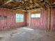 Bedroom construction featuring pink insulation, window frames, and an open floor plan at 336 Caladium Ave, Lake Alfred, FL 33850