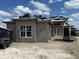 View of a modern home, featuring a stucco exterior, a window and a trailer at 336 Caladium Ave, Lake Alfred, FL 33850