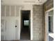 Interior view of home under construction showing doorway, block walls, and in progress drywall installation at 336 Caladium Ave, Lake Alfred, FL 33850