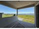 Enjoy lake views from the covered patio with tile floors, creating a serene outdoor space at 336 Caladium Ave, Lake Alfred, FL 33850