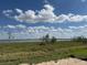 Beautiful view of the water from this prime location with lots of greenery and blue skies overhead at 336 Caladium Ave, Lake Alfred, FL 33850