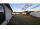 Large backyard with white fencing and space for landscaping or recreation at 3810 Arboreal Ct, Deland, FL 32724