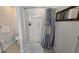 Bathroom with a shower featuring a blue patterned shower curtain at 3810 Arboreal Ct, Deland, FL 32724