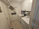 Bright laundry room with washer, dryer, and storage cabinets at 3810 Arboreal Ct, Deland, FL 32724