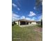 Large backyard, partially fenced with a patio, perfect for outdoor activities at 3869 Carrick Bend, Kissimmee, FL 34746