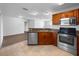 Well-lit kitchen featuring stainless steel appliances and ample counter space, connected to other rooms at 3891 Sw 130Th Loop, Ocala, FL 34473