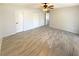 Large bedroom with ceiling fan, tile floors, and ensuite bathroom at 4057 Amron Dr, Orlando, FL 32822